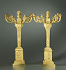 A fine pair of Empire gilt bronze six-light candelabra, one surmounted by the head of Apollo representing Day